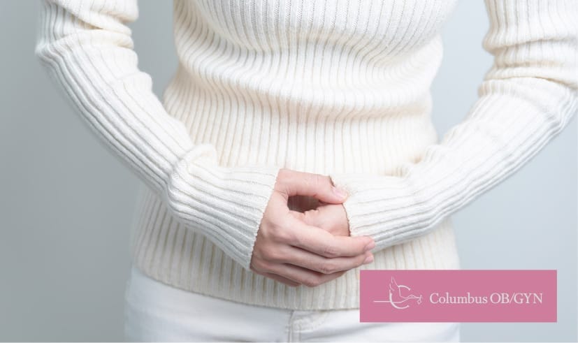 Woman experiencing abdomen ache