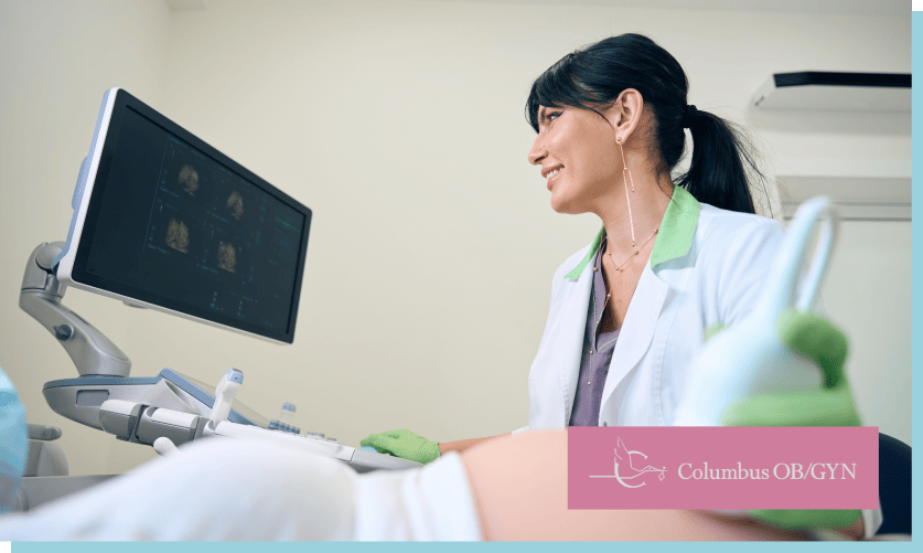 OB/GYN performing prenatal ultrasound screening on pregnant patient